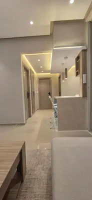 a lobby with chairs and a counter in a building at Rabat Residence - OCEAN STAY 2 in Rabat