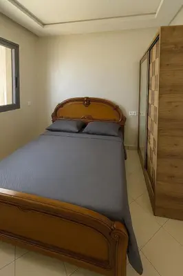 a bedroom with a large bed in a room at Apartment for rent el mansoria in Mansouria
