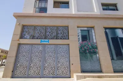 a building with a gate and flowers in a window at Bourgogne Bliss in Casablanca