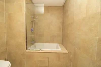 a bathroom with a shower and a bath tub at Bourgogne Bliss in Casablanca