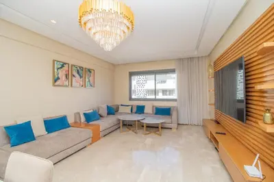 a living room with a couch and a table at Bourgogne Bliss in Casablanca