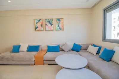 a living room with a couch and a table at Bourgogne Bliss in Casablanca