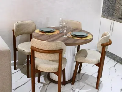 a dining room table with chairs and a wooden table at Holiday Harmony in Roches Noires