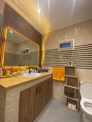 a bathroom with a sink and a toilet at Dream villa with a pool