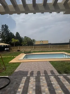 a swimming pool in the middle of a yard at Dream villa with a pool