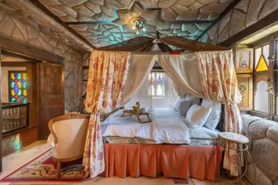 a bedroom with a canopy bed in a castle at Lakala Complexe Touristique in O Ben Slimane