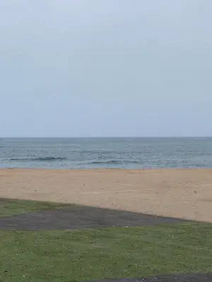 a sandy beach with the ocean in the background at Appartement luxe in Casablanca