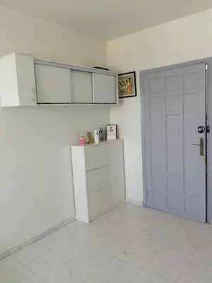 a kitchen with a white door and a white refrigerator at Mydar ocean in Rabat