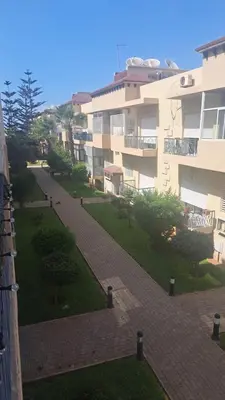 a walkway in front of a building at Appart Coquette à Tamariss in Tamaris