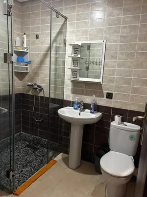 a bathroom with a toilet and a sink and a shower at Modern Studio by the Beach of Casablanca Night Stay in Casablanca