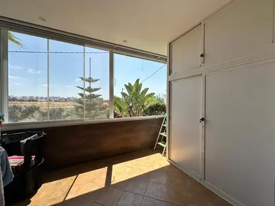 a room with a large window and a room with a view at Les jardins de cherrat in Bouznika