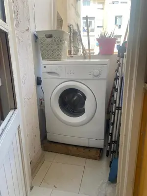 a washer and dryer in a small room at Comfort and Convenience in Casablanca