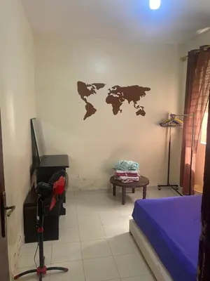 a room with a bed and a map on the wall at Comfort and Convenience in Casablanca