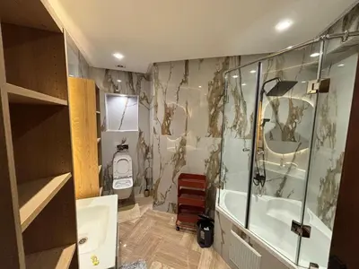 a bathroom with a shower and a tub and a toilet at Escape for the whole family in Casablanca