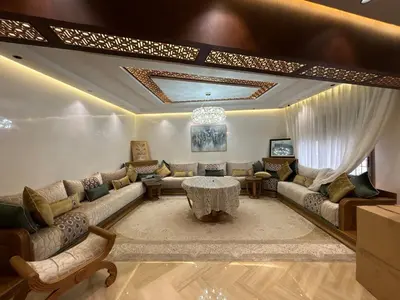 a living room with a couch and a table at Escape for the whole family in Casablanca