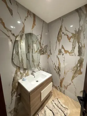 a bathroom with a sink and a mirror at Escape for the whole family in Casablanca