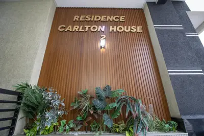a brown door with a reference garden house on it at Les rochers in Casablanca