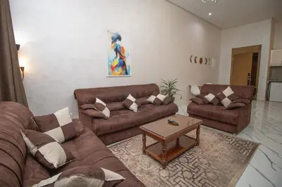 a living room with two couches and a coffee table at Les rochers in Casablanca