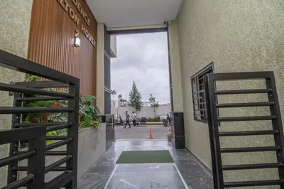 a hallway of a building with a green mat on the ground at Les rochers in Casablanca