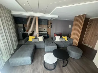 a living room with a couch and a table at Charming studio ready to live in in Casablanca