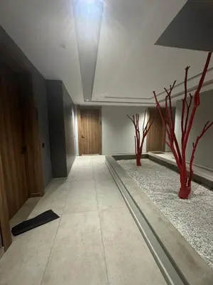 a hallway with two trees in the middle of a room at Charming studio ready to live in in Casablanca