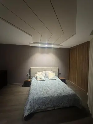 a bedroom with a large bed with two pillows at Charming studio ready to live in in Casablanca