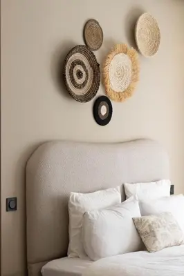 a bedroom with a bed with hats on the wall at BRYJ 34 Luxury studio les princesses maarif in Casablanca