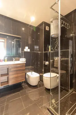 a bathroom with a tub and a toilet and a sink at BRYJ 34 Luxury studio les princesses maarif in Casablanca