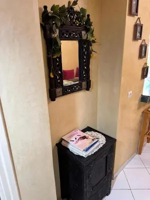 a mirror on a wall next to a table at Modern appartment in Casablanca