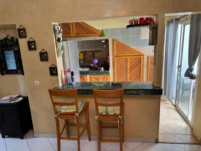 a kitchen with two chairs and a counter top at Modern appartment in Casablanca