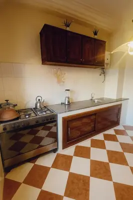 a kitchen with a sink and a stove and cabinets at Traditional Moroccan Apartment, Oulfa, Hajj Fateh in Casablanca