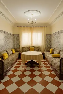 a living room with two couches and a table at Traditional Moroccan Apartment, Oulfa, Hajj Fateh in Casablanca