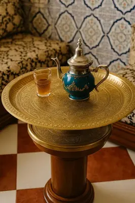 a table with a tea pot and a cup on it at Traditional Moroccan Apartment, Oulfa, Hajj Fateh in Casablanca