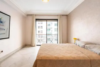 a bedroom with a large bed and a large window at Chic appartement in Casablanca in Casablanca