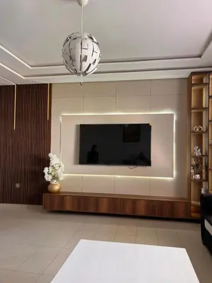a living room with a flat screen tv on a wall at Luxury apartment in Mansouria in Mansouria