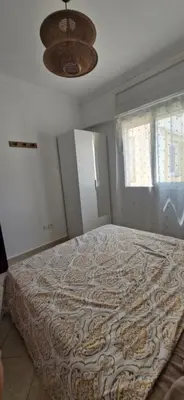 a bedroom with a large bed in a room at Séjour Idéal Piscine & Sécurité in Bouznika