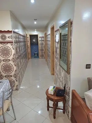 a hallway with a table in a room at Spacious Apartment Casablanca in Casablanca
