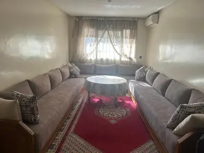 a living room with a couch and a table at Spacious Apartment Casablanca in Casablanca