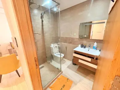 a bathroom with a shower and a toilet and a sink at cozy furnished studio fully equipped in Casablanca