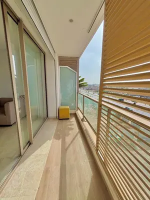 a room with a balcony with a view of the water at La perla del Atlántico in Casablanca