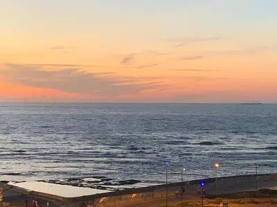 a view of the ocean at sunset at Studio Corniche Casablanca in Casablanca