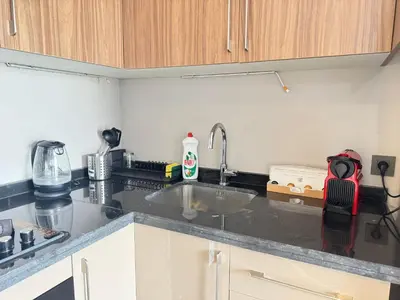 a kitchen with a sink and a counter top at Élégant Studio Neuf Quartier 2 Mars Sécurisé in Aïn Chock