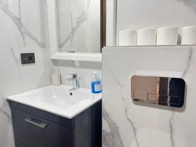 a bathroom with a sink and a mirror at Élégant Studio Neuf Quartier 2 Mars Sécurisé in Aïn Chock