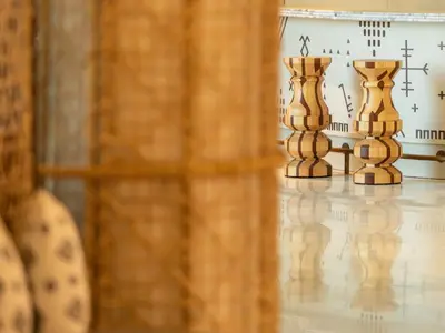 a row of wooden vases sitting on a table at STORY Le Carrousel Rabat in Rabat