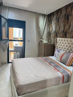 a bedroom with a large bed in a room at Les perles de tamaris in Casablanca
