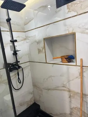 a bathroom with a shower with a mirror at Les perles de tamaris in Casablanca