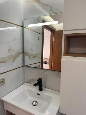 a bathroom with a sink and a mirror at Les perles de tamaris in Casablanca