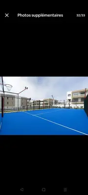 a picture of a tennis court with at Appartement de prestige à Dar bouazza avec plusieurs piscines et à proximité à la plage in Tamaris
