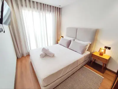 a bedroom with a bed with two towels on it at Studio Confortable et Cozy 5 min du stade CAN2025- Maarif Casablanca in Casablanca