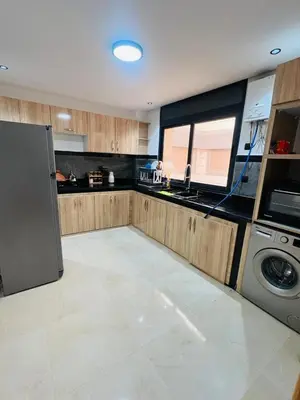 a kitchen with a refrigerator and a dishwasher at 322 Costa beach , Bouznika in Bouznika